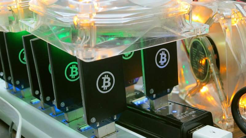Bitcoin mining hardware photographed in use