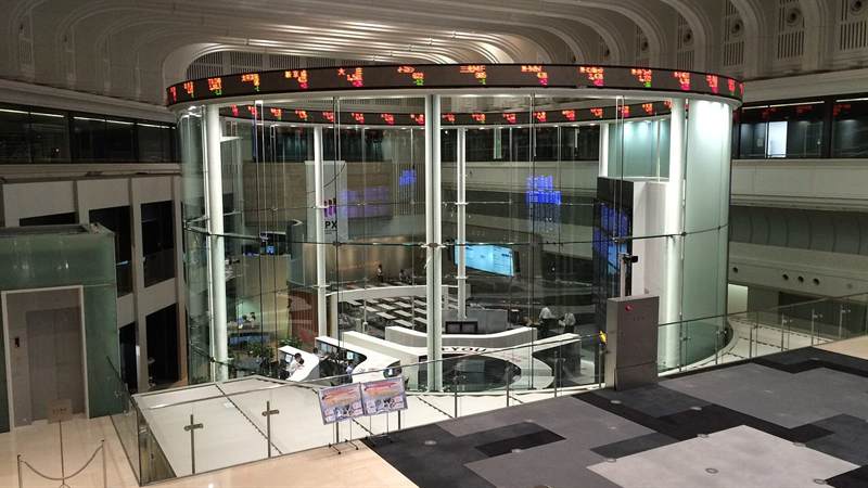 Tokyo Stock Exchange hall with the JPX ticker ring